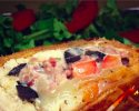 Shredded chicken, red peppers, black olives, and Swiss cheese, grilled.